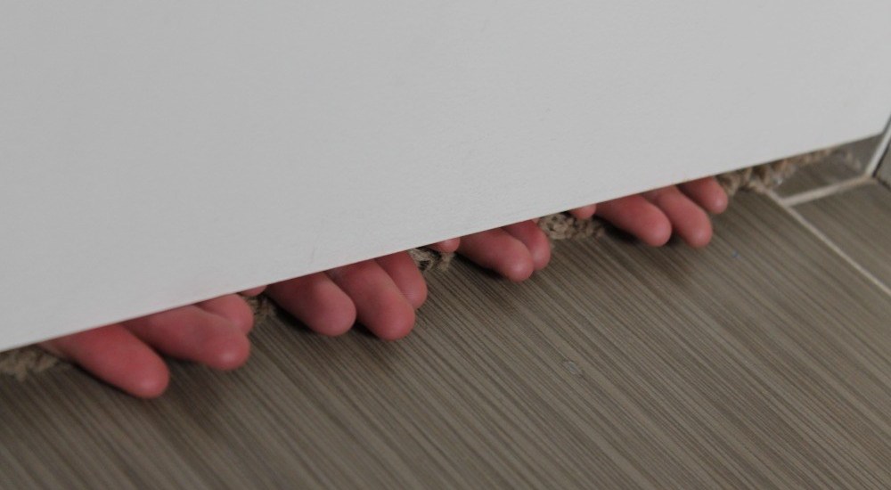 fingers under door